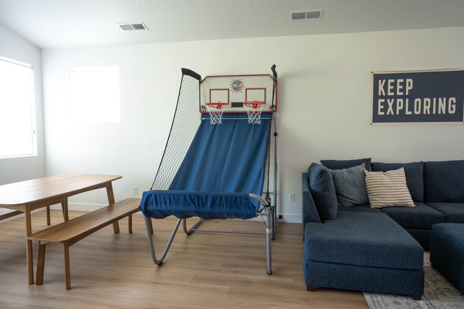 Game loft with a basketball arcade and large sectional